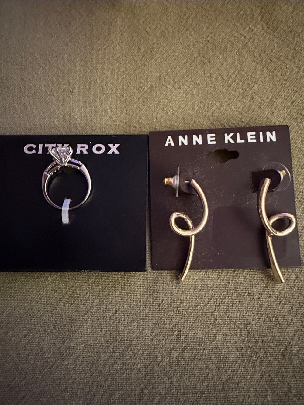 Anne Klein Gold Curved Loop Drop Earrings and silver tone ring.